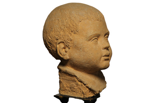 Scultura in terracotta rappresentante testa di bambino 