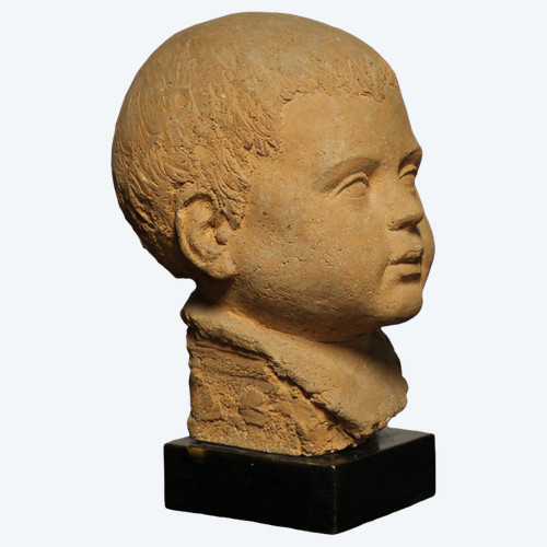 Scultura in terracotta rappresentante testa di bambino 
