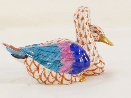 Couple of white porcelain ducks with orange fish scale net pattern 