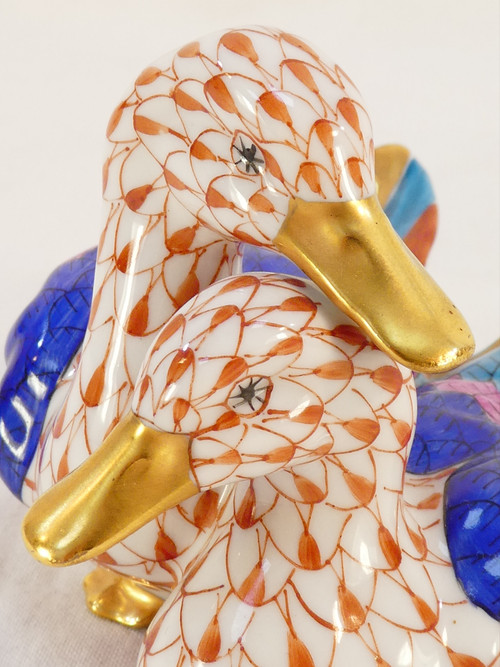 Couple of white porcelain ducks with orange fish scale net pattern 