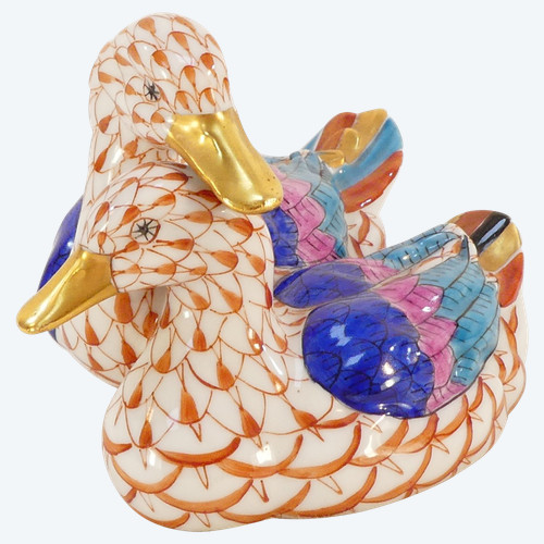 Couple of white porcelain ducks with orange fish scale net pattern 