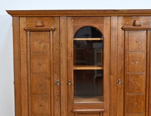 Oak bookcase with three doors