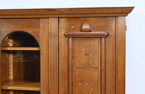 Oak bookcase with three doors