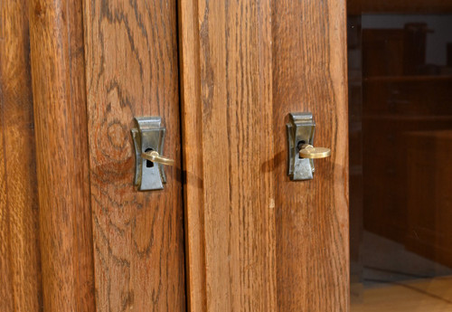 Oak bookcase with three doors