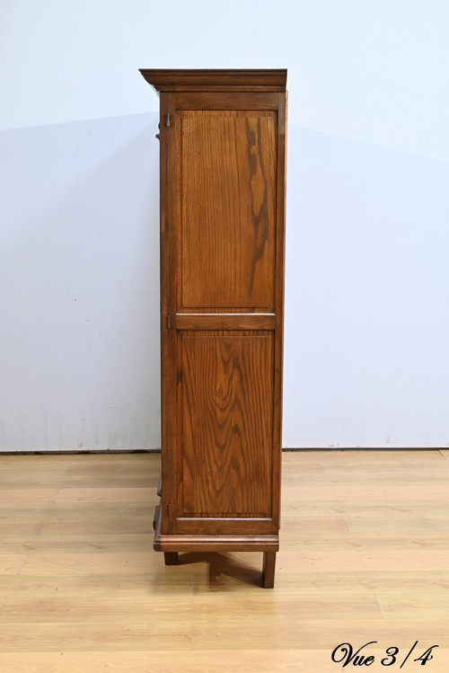 Oak bookcase with three doors