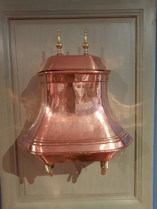 Fountain and its copper basin from the 18th century.