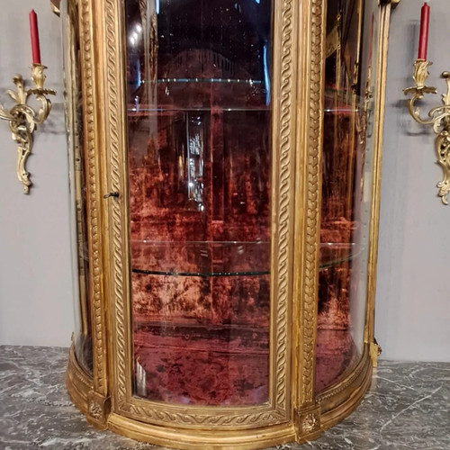 Louis XVI period display case, carved and gilded wood