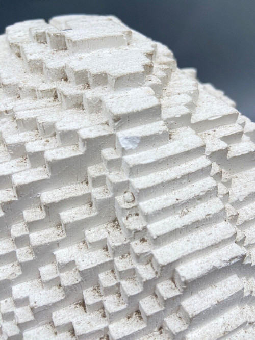 Sculpture in cellular concrete, pixelation of a man's face 1970