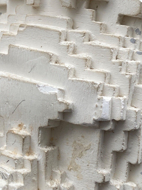 Sculpture in cellular concrete, pixelation of a man's face 1970