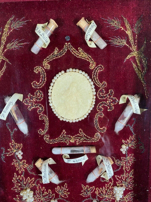 Rare 19th century reliquary seven wax relics medallion red velvet background