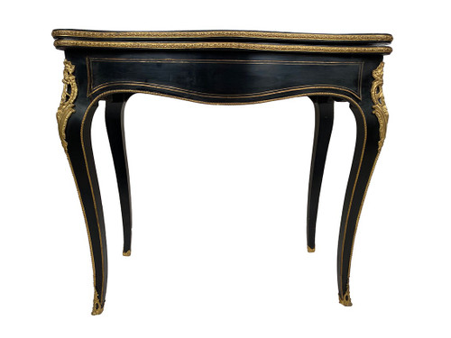 Console Napoléon III formant table à jeux, bois noirci et marqueterie de laiton