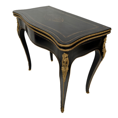 Console Napoléon III formant table à jeux, bois noirci et marqueterie de laiton