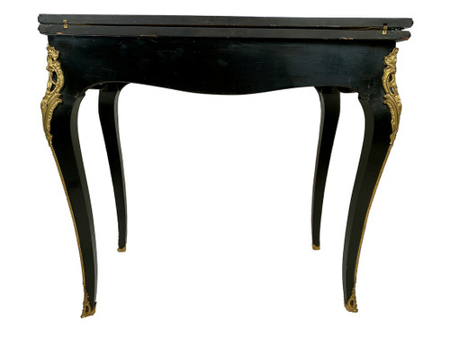Console Napoléon III formant table à jeux, bois noirci et marqueterie de laiton