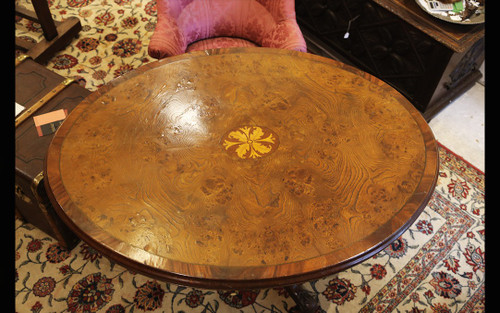 Oval table in marquetry and varnished wood 