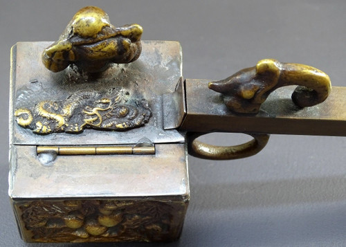 Japan, 1930s/1950s, Bronze inkwell with relief decoration of a figure and a dragon.