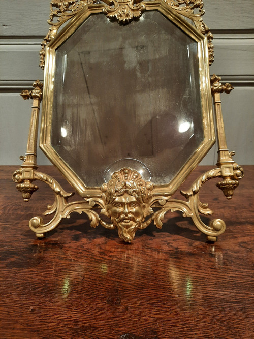 Miroir de salon en bronze de style Régence d’époque XIXème siècle.