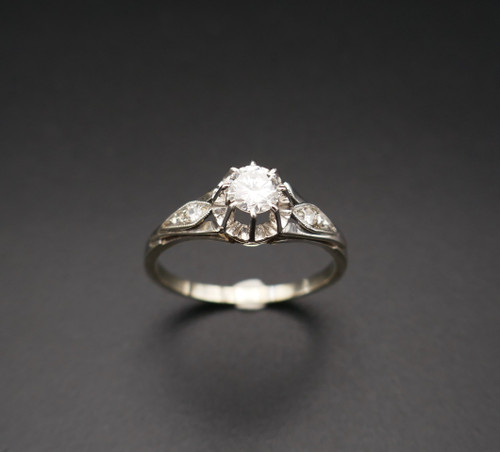 Diamond solitaire, gold and platinum setting.