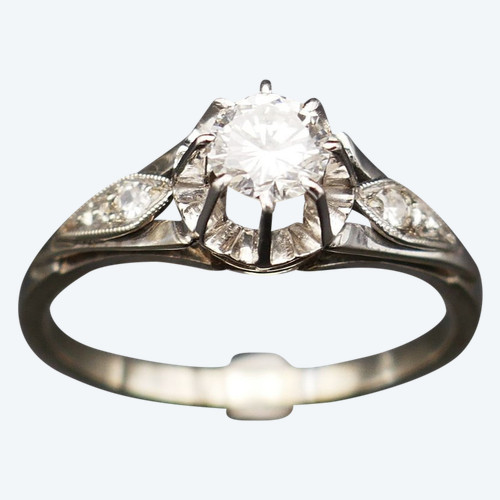 Diamond solitaire, gold and platinum setting.