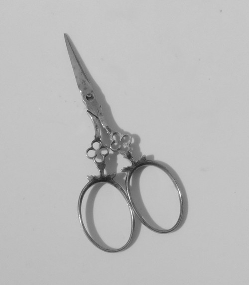 Small pair of steel embroidery sewing scissors in its 19th century leather-covered case
