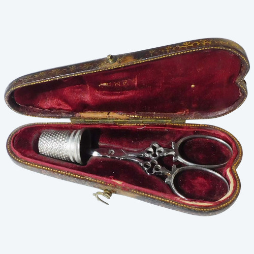 Small pair of steel embroidery sewing scissors in its 19th century leather-covered case