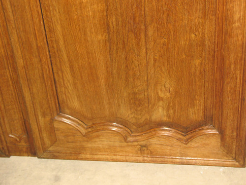 Pair of Louis XV style woodwork doors in carved oak, early 19th century