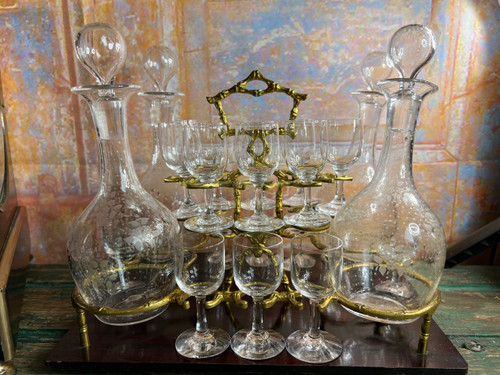 Napoleon III liqueur cellar in black wood, with brass fillets and chased glass portholes