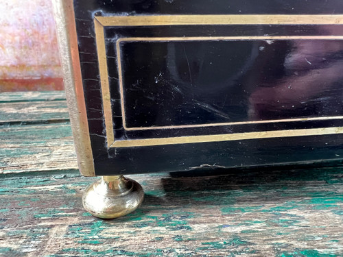 Napoleon III liqueur cellar in black wood, with brass fillets and chased glass portholes