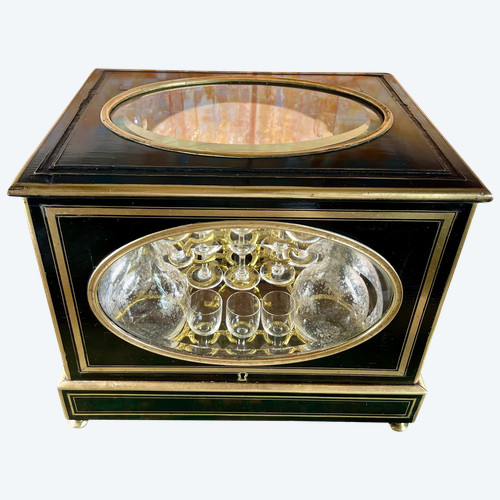 Napoleon III liqueur cellar in black wood, with brass fillets and chased glass portholes