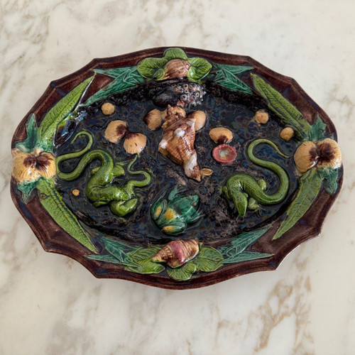 Barbotine dish decorated with shells and Palissy lizard