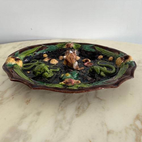 Barbotine dish decorated with shells and Palissy lizard
