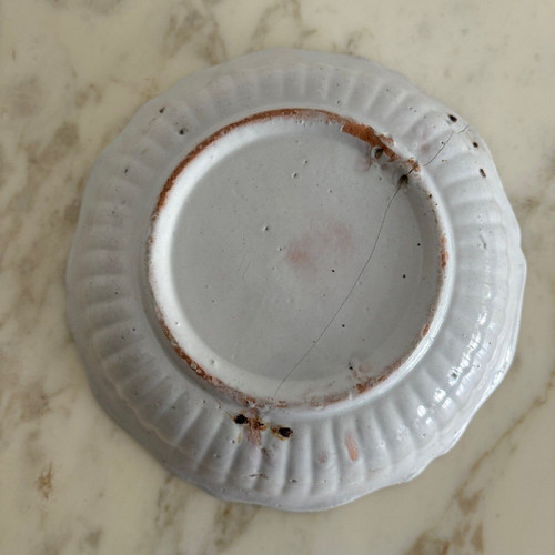 18th century Nevers earthenware salad bowl with gadrooned dog decoration