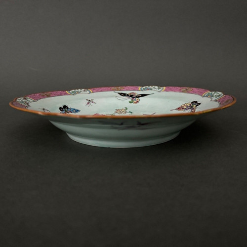 China plate with 19th century signature decorated with butterflies and vegetation