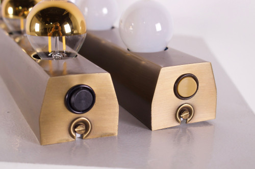 “Vanity lamp” dressing room wall lights, bronze finish.