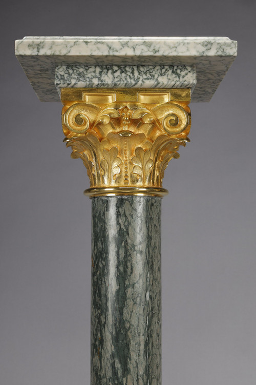 Pair of green Estours marble columns with Corinthian capitals