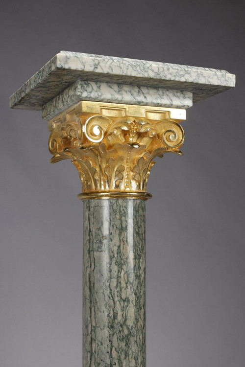 Pair of green Estours marble columns with Corinthian capitals
