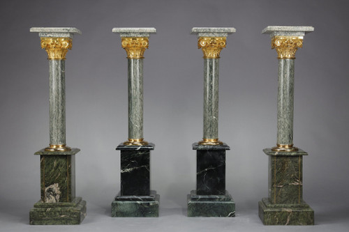 Pair of green Estours marble columns with Corinthian capitals