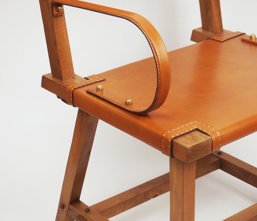 Poltrona in pelle di Jacques Adnet