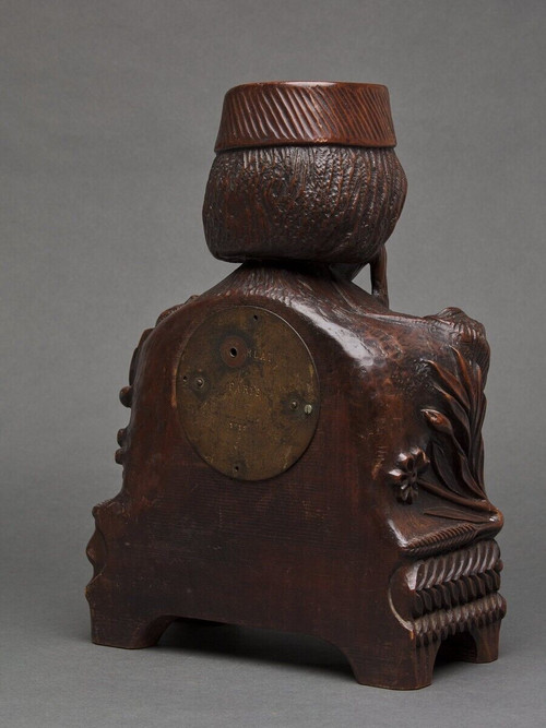 Richly ornamented carved wooden clock 19th century Chinese sage