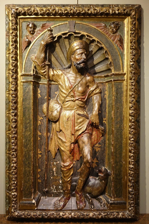 Half-relief in gilded and polychromed wood, representing Saint Roch. Spain, 16th century.