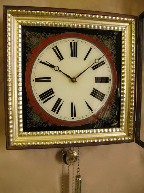 A highly decorative original reverse painted glass (Verre Eglomise) dial wall clock from the