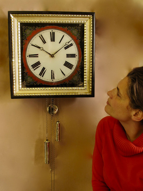 A highly decorative original reverse painted glass (Verre Eglomise) dial wall clock from the