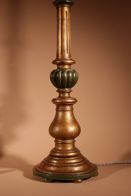 A pair of highly decorative Italian Renaissance style turned and carved giltwood floor lamps