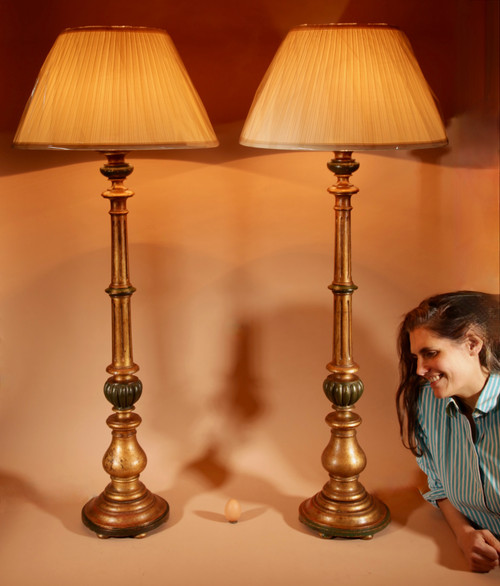 A pair of highly decorative Italian Renaissance style turned and carved giltwood floor lamps