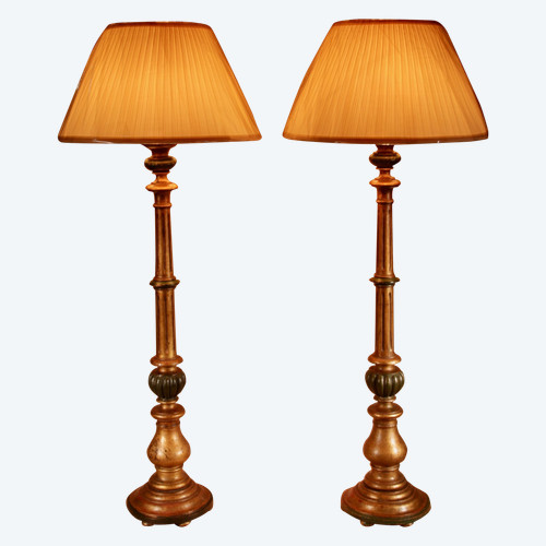 A pair of highly decorative Italian Renaissance style turned and carved giltwood floor lamps