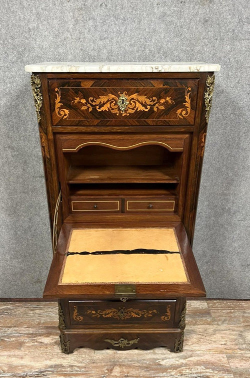 Lady's secretary in marquetry of noble woods depicting floral scrolls and a vase.