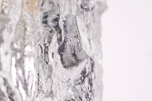 An Ice Glass bark wall sconce.