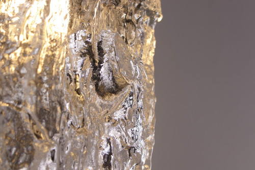 An Ice Glass bark wall sconce.