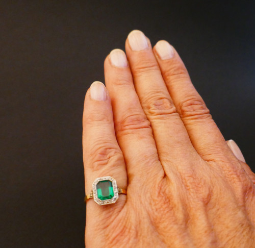Antique ring set with an emerald and rose-cut diamonds.