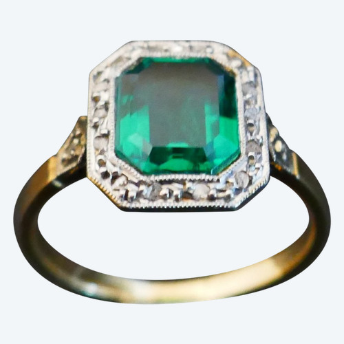 Antique ring set with an emerald and rose-cut diamonds.