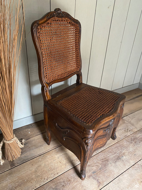 Louis XV commode chair from the 18th century in walnut